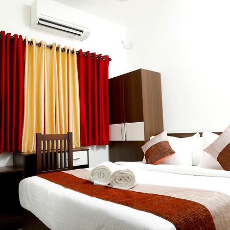 Puthens Clifton Inn Котаям Екстериор снимка