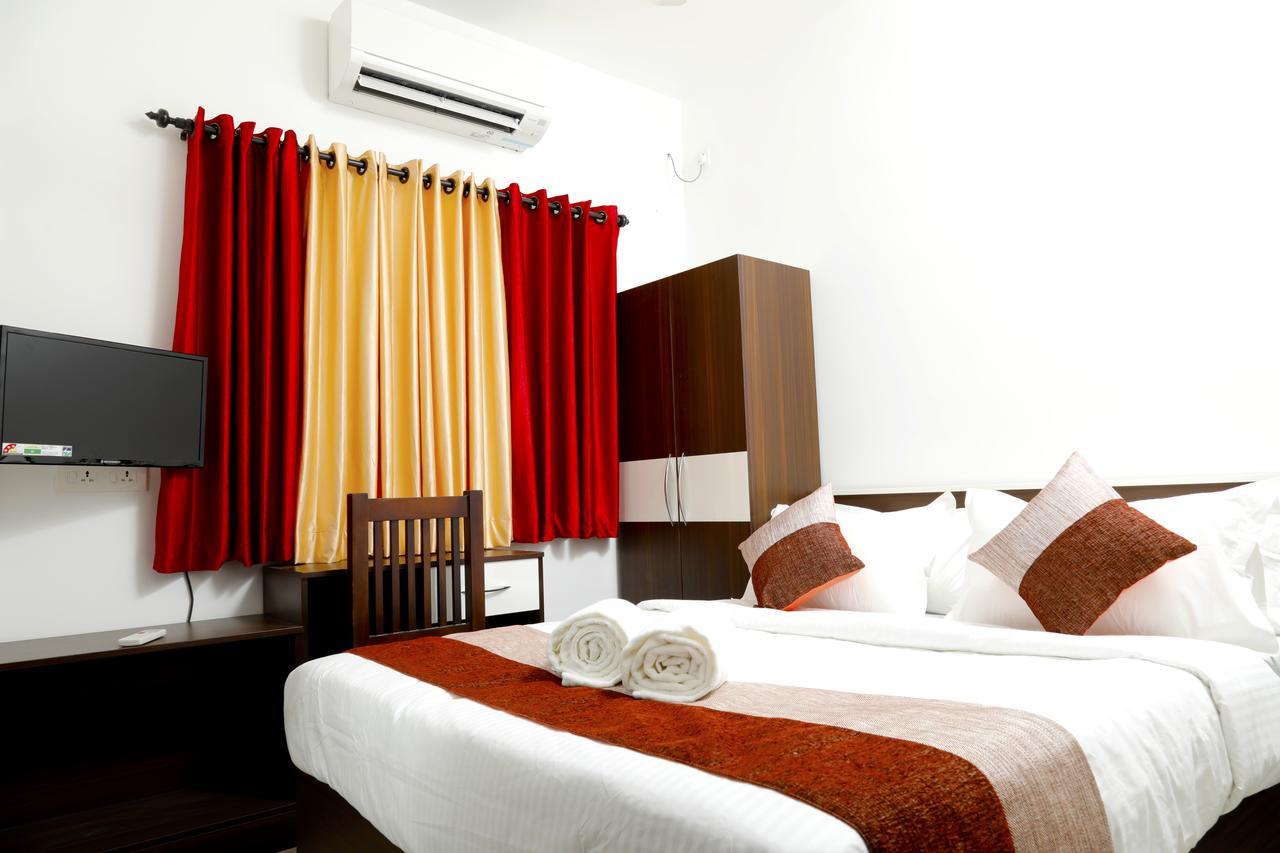 Puthens Clifton Inn Котаям Екстериор снимка