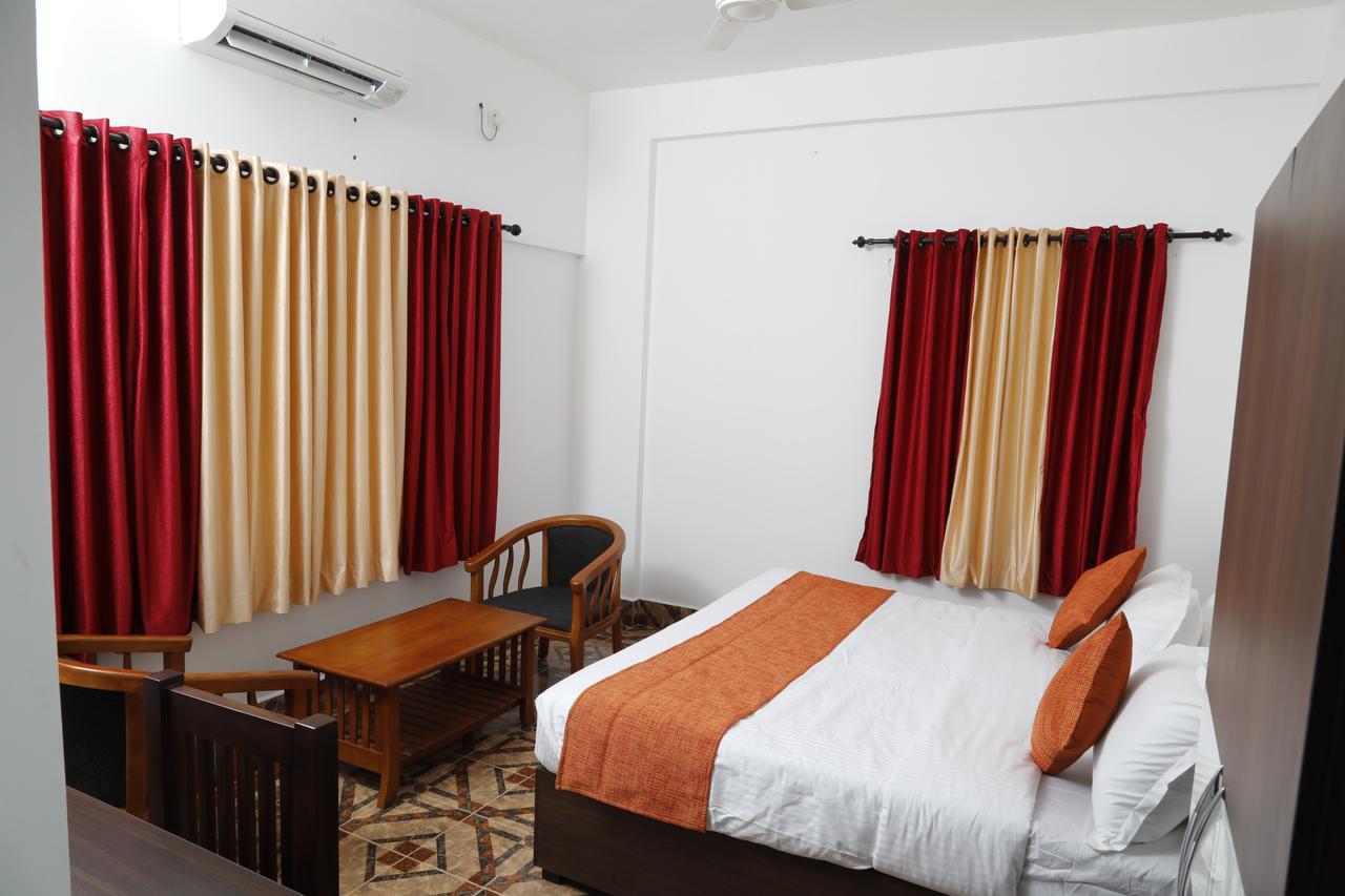 Puthens Clifton Inn Котаям Екстериор снимка